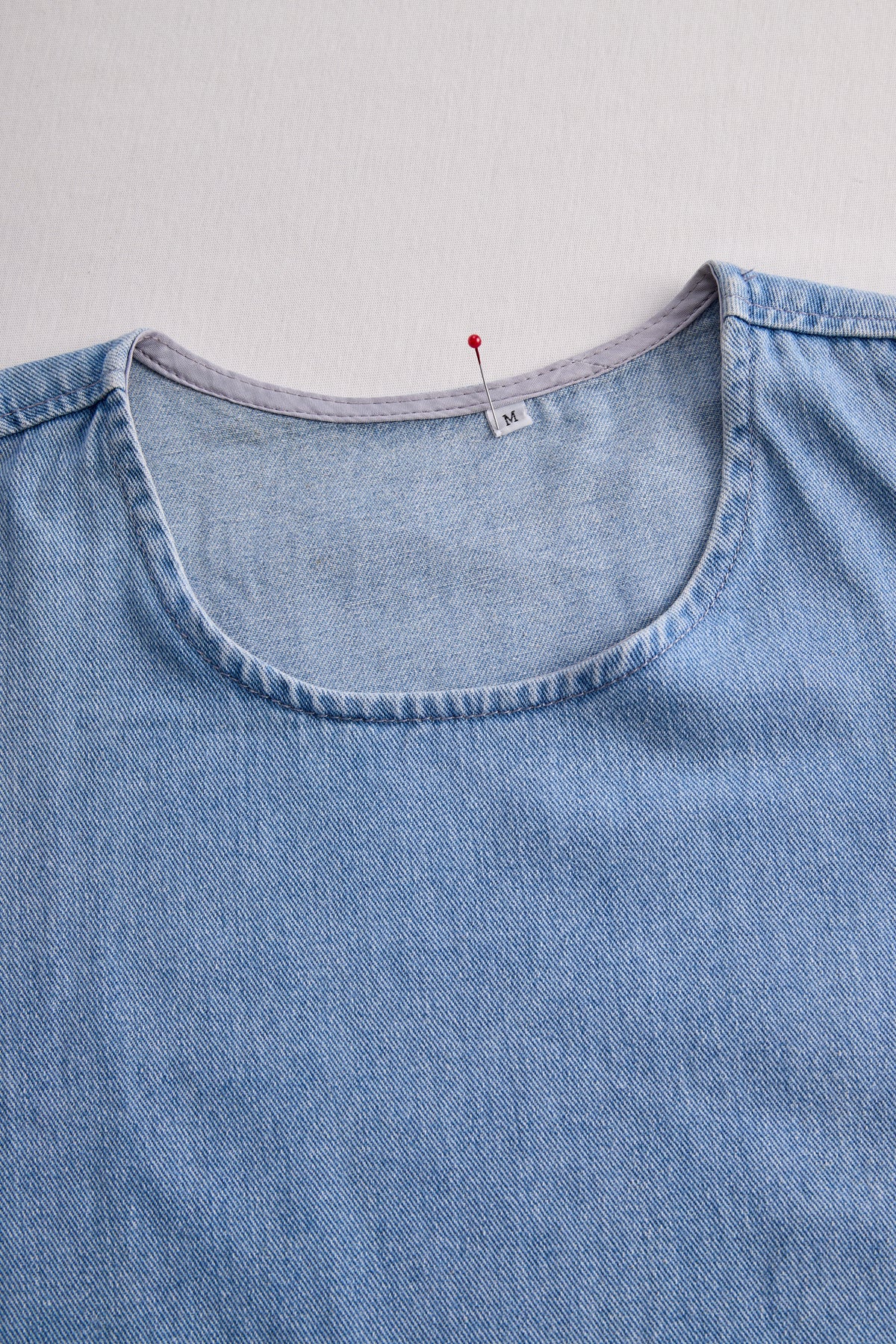 Stylish Denim Two-Piece Set With Asymmetrical Top And Fringed Skirt